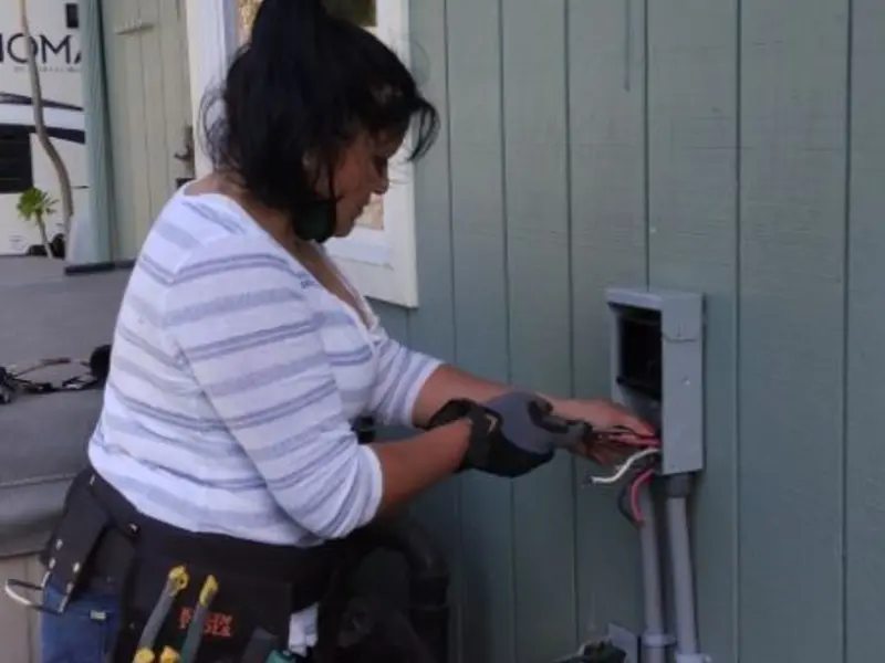 Licensed electrician wiring an exterior subpanel in Madera Acres